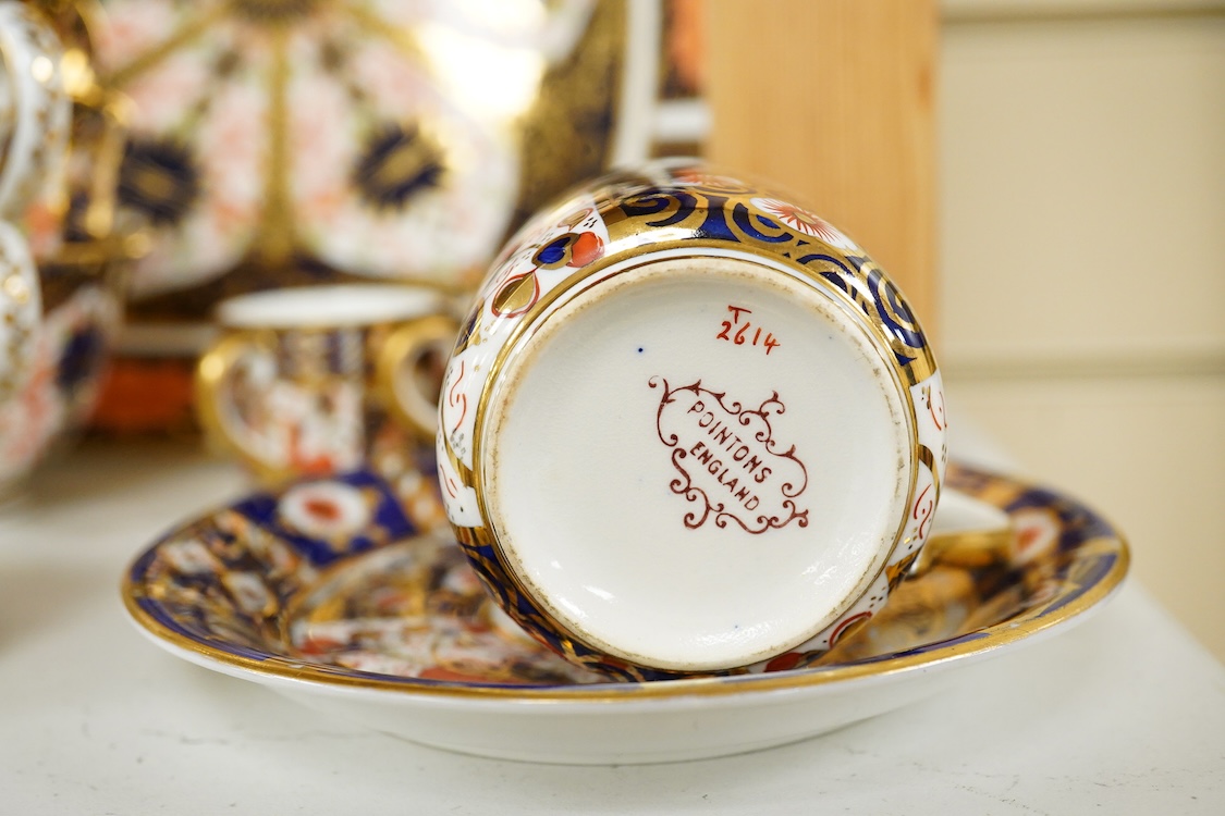 A quantity of Royal Crown Derby Imari to include a sandwich plate, cups and saucers and and miniature twin handled cups, largest 27cm in diameter
